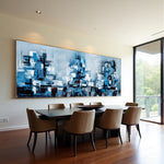 Blue Metropolis blue abstract cityscape painting displayed above a modern dining table