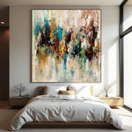 Distant Gathering square abstract painting with layered cream, teal, black, rust and orange marks above a modern bed