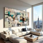 Earth and Echo neutral abstract painting above a sectional sofa with a city skyline visible through the windows
