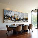 Golden Faultline abstract painting above a dining table in a bright room with garden views